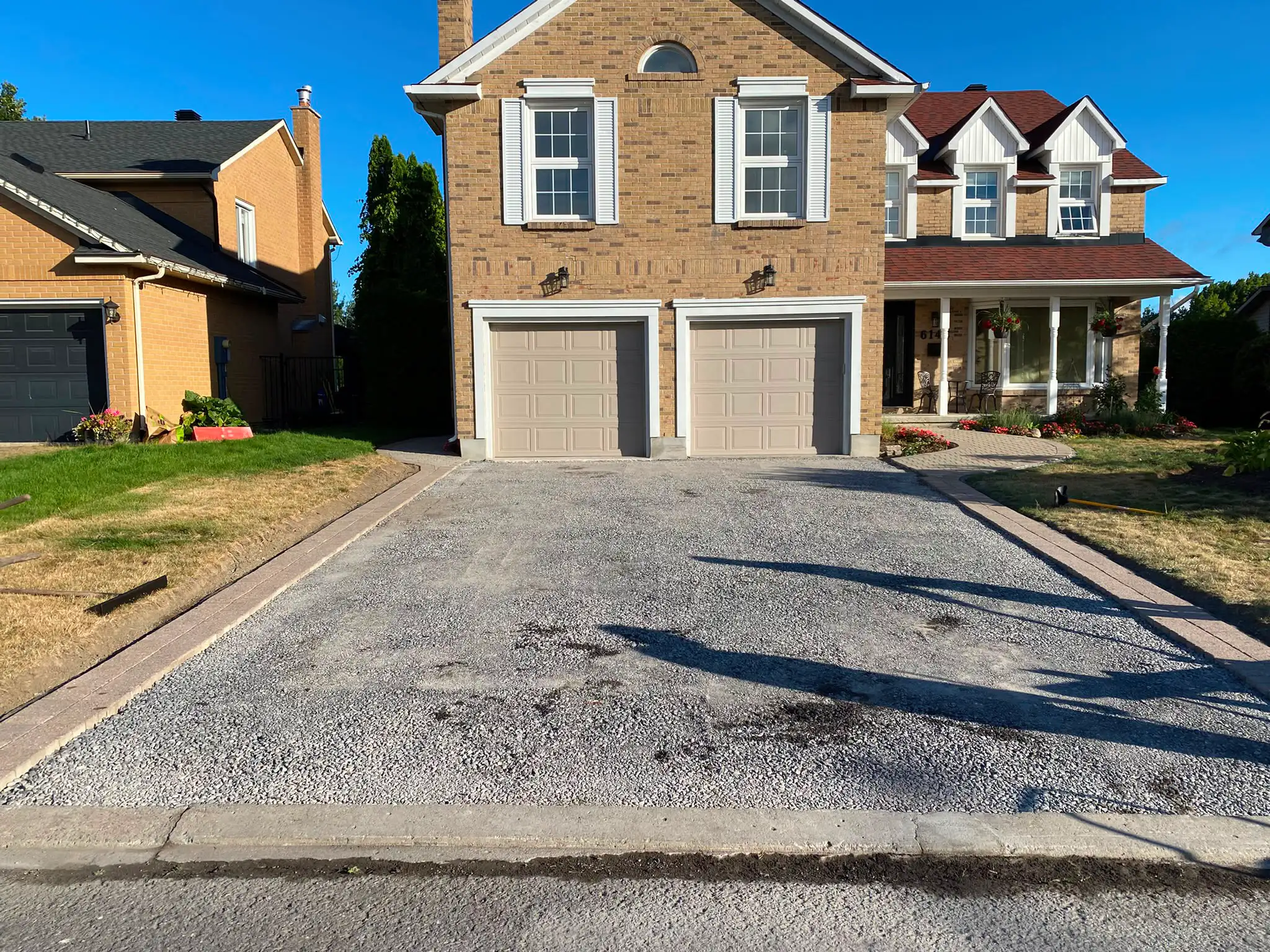 Asphalt driveway paving installation 8